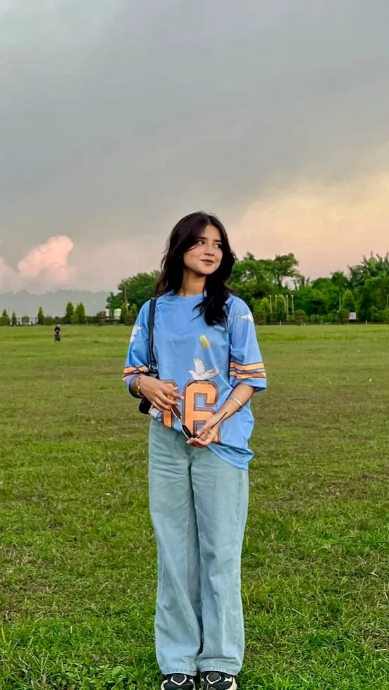 Candid Full-Length Outdoor Meadow Portrait of Young Woman in Baggy Streetwear