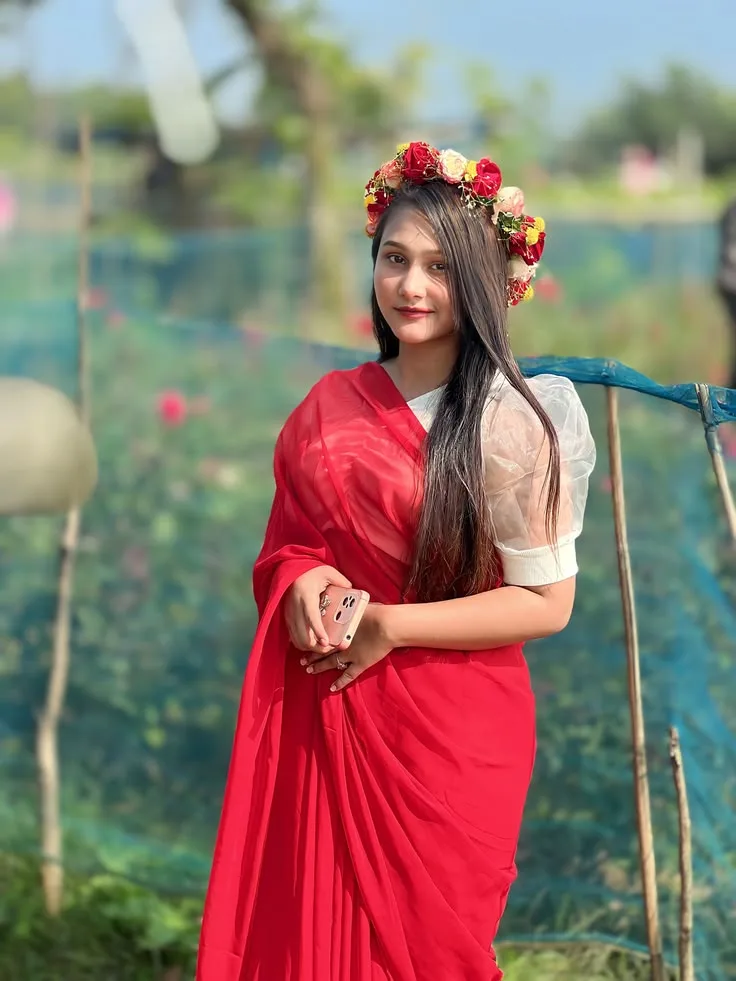 Candid Outdoor Garden Portrait of Indian Woman in Red Saree with Floral Tiara