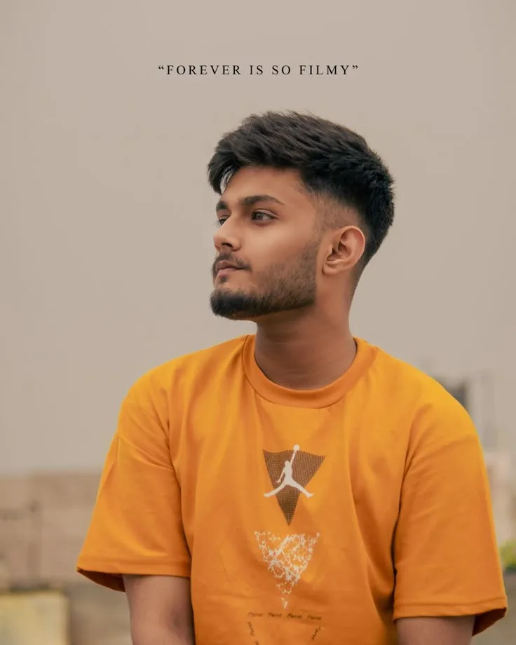 Candid Rooftop Profile Portrait of Young Man in Mustard Yellow Oversized Tee