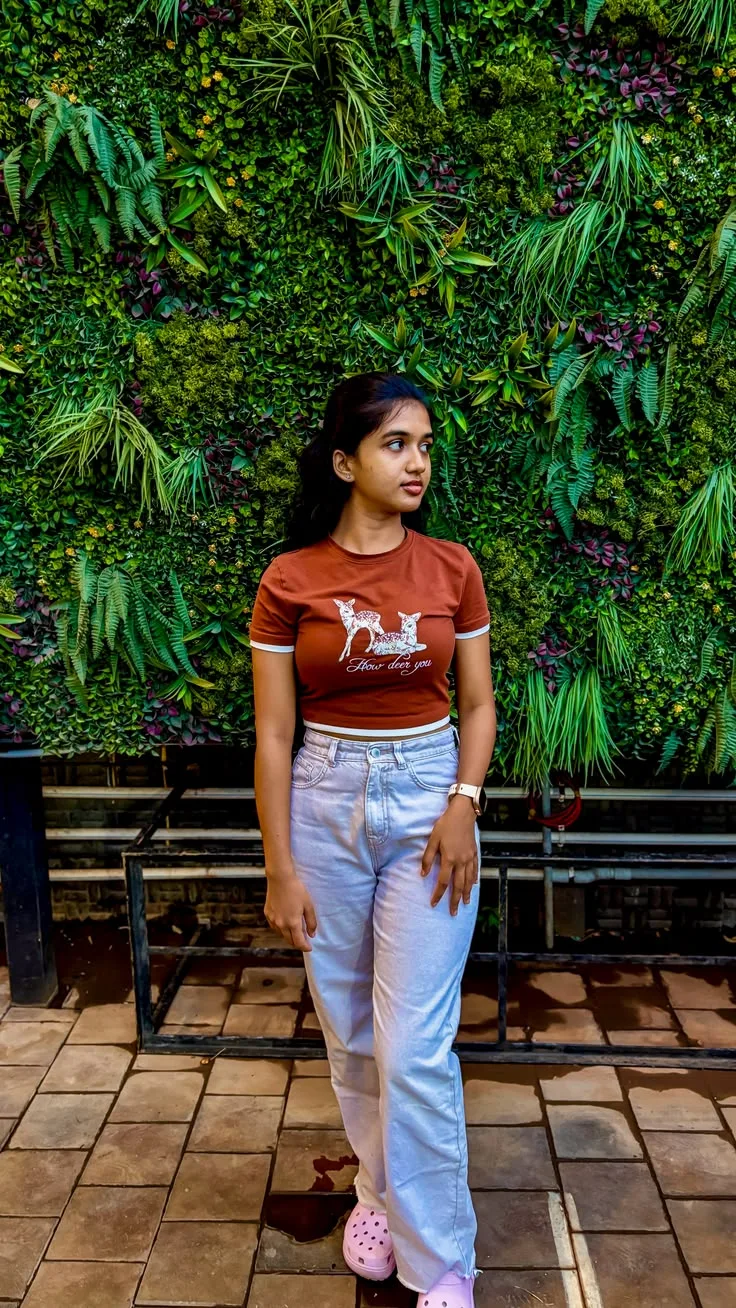 Full-Length Female Casual Portrait Against Vertical Living Plant Wall Prompt