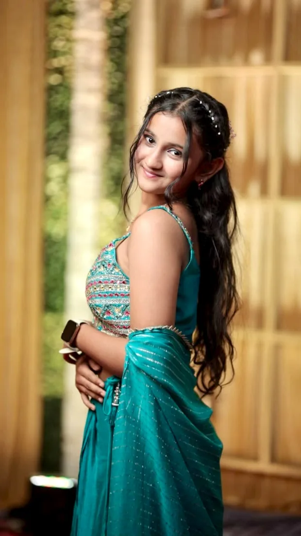 Candid Event Portrait of Young Indian Woman in Embellished Teal Lehenga