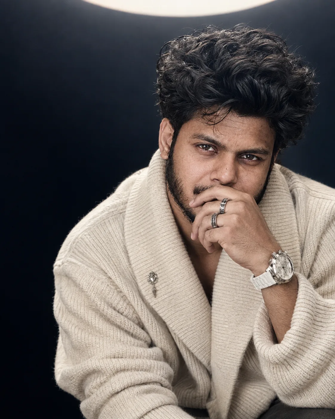 Intense Curly-Haired Portrait in Beige Knit